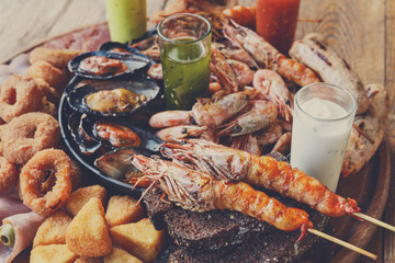 Seafood platter on wooden table background