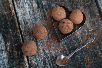 Truffle chocolate candies on cocoa powder