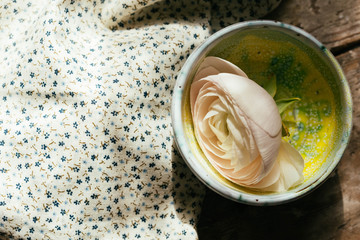 White floating ranunculus flowers. Spa wellness background Copy space