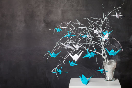 Origami paper cranes on n branches