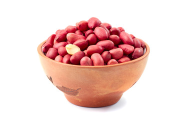 Peanuts in ceramic bowl on white