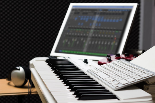 music computer concept, piano & computer in sound studio for music production