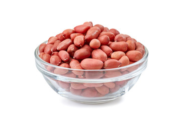 Peanuts in glass bowl on white