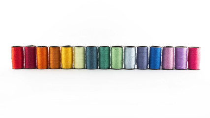 Sewing threads on white background