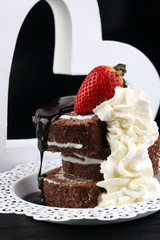 Chocolate yule log christmas cake. Valentine day cake with straw