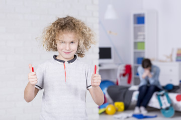 Mean boy with broken pencil