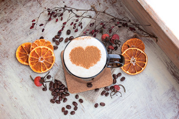 Coffee with a skin on a wooden tray selective focus