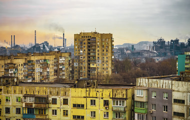 apartment buildings district and factory background, air pollution
