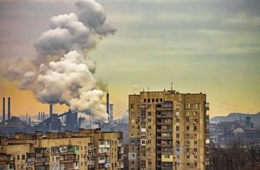 apartment buildings district and factory background, air pollution