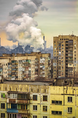 Fototapeta na wymiar apartment buildings district and factory background, air pollution