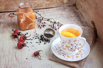 Tea with a lemon and apple jam selective focus