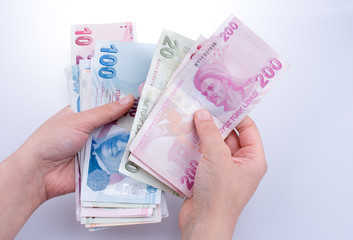 Hand holding Turksh Lira banknotes  in hand