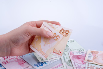 Hand holding Turksh Lira banknote  in hand