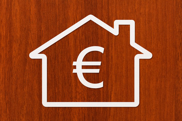 Paper house with euro inside. Conceptual image