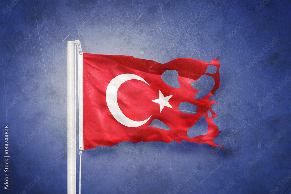 Wall mural Torn flag of Turkey flying against grunge background