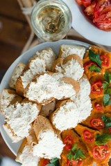A lot of sandwiches with cheese dip, garlic and herbs, pumpkin caviar, bell pepper.
