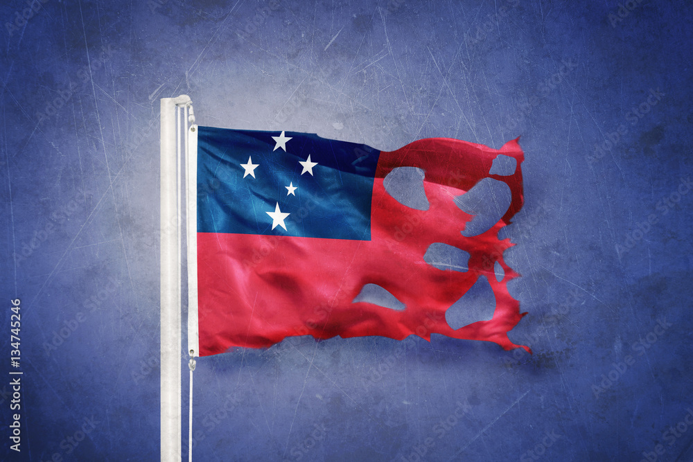 Wall mural Torn flag of Samoa flying against grunge background