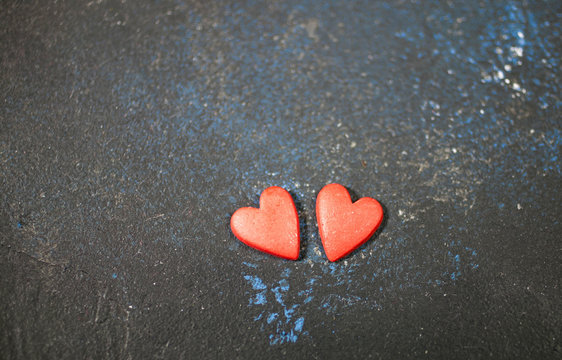 Two red hearts on a dark background. Valentine's day. Selective focus