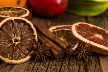 Dried oranges and grapefruits on an old wooden table.