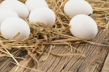 Eggs on wooden background.