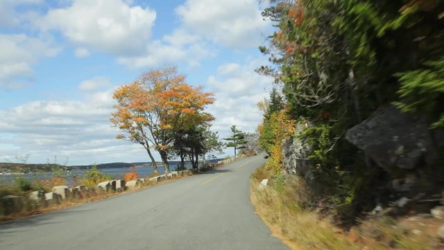 Driving along Somes Sound on Sargent Drive in Acadia National Park in Autumn.