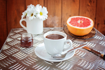 Coffee, grapefruit. Breakfast. Selective focus