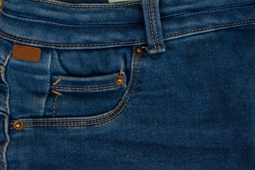 Jeans background of blue denim textile