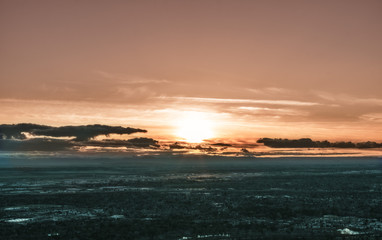 Fototapeta na wymiar Sunset over valley city