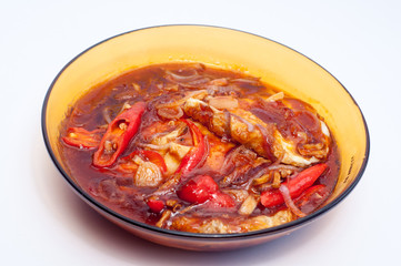fried eggs cooked with sauce