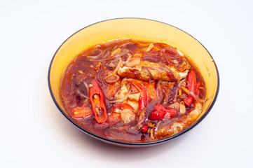 fried eggs cooked with sauce