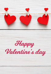 Valentine day background, paper hearts border on wood, copy space