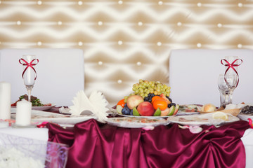 Head red color table for the newlyweds at the wedding hall.