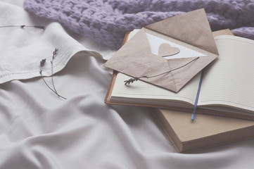 Notebook letter and book with lavender on a bed in a gray tint. Diary Envelope Lifestyle Plaid...