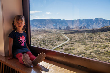 Fototapeta na wymiar Little girl in Teide National Park, Tenerife, Canary island, Spain