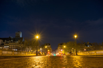 Fototapeta na wymiar Bridge by the Seine river in Paris at night