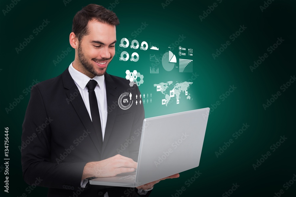 Poster composite image of smiling businessman standing and using laptop