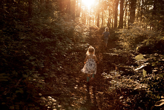 Two children walking outdoors