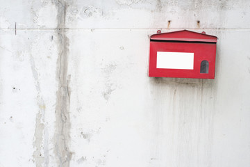 red old mailbox on wall