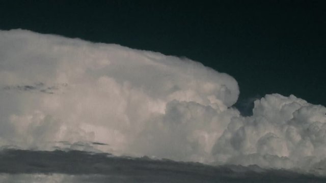 White Clouds Swell Against Blue Sky