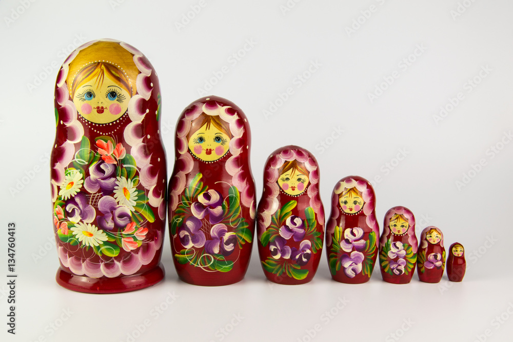 Wall mural Russian nesting dolls on a white background.