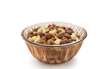 Fototapeta na wymiar almonds, hazelnuts, cashews nuts in the plate