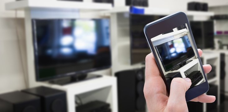 Composite image of woman using her mobile phone