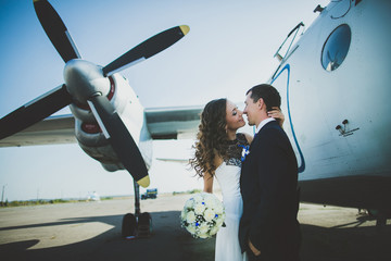 happy wedding couple bride and groom riding helicopter