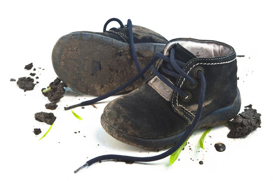 Isolated muddy child footwear shoes