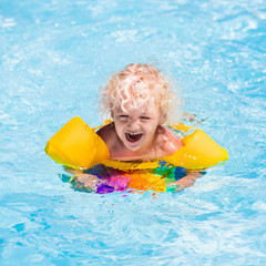 Little boy in swimming pool