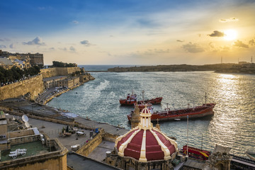 Valletta, Malta - Sunrise at the Grand Harbor of Valletta, the capital city of Malta with blue sky...