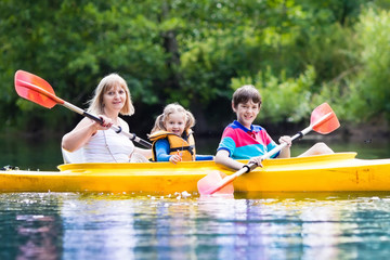 Family enjoying kayak ride on a river