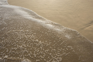 Ocean water on beach sand