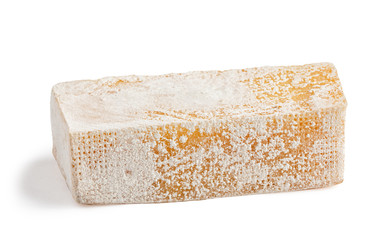 moldy piece of old cheese isolated on white background