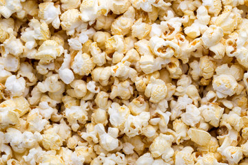 Popcorn background. Caramel sweet corn. Cinema snack.